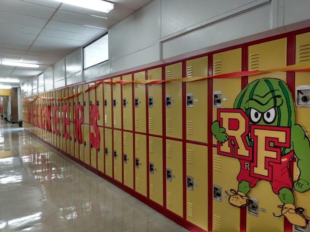 lockers decorated with red and gold plus image of mad melon mascot
